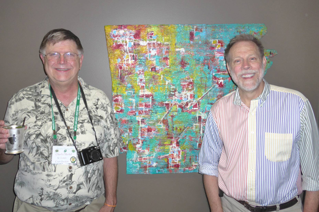 In the spirit of that day's Kentucky Derby, mint juleps were the drink du jour as shown here with Charles Merkel to the left of the Arkansas map and Steven Clift on the right.