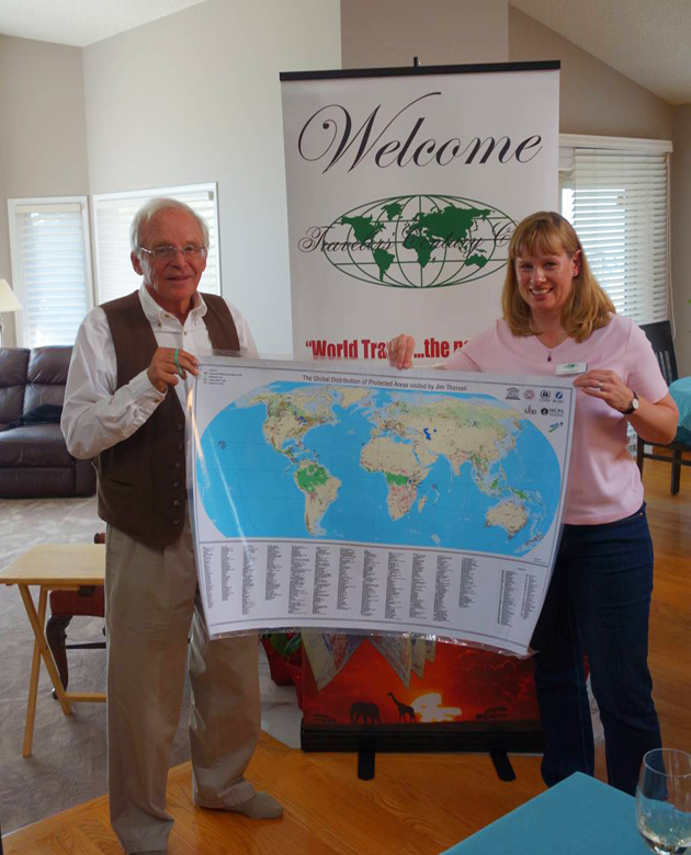 Guest speaker, Jim Thorsell, UNESCO and IUCN, together with Lana Skeet, holding a map of the UNESCO sites he has inspected and visited. 